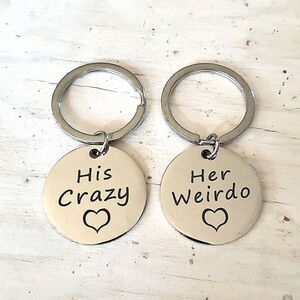 Key rings, his and hers, silvertone